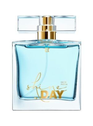 Flacon transparent bleu ciel du parfum Shine by Day de LR avec capuchon transparent et doré